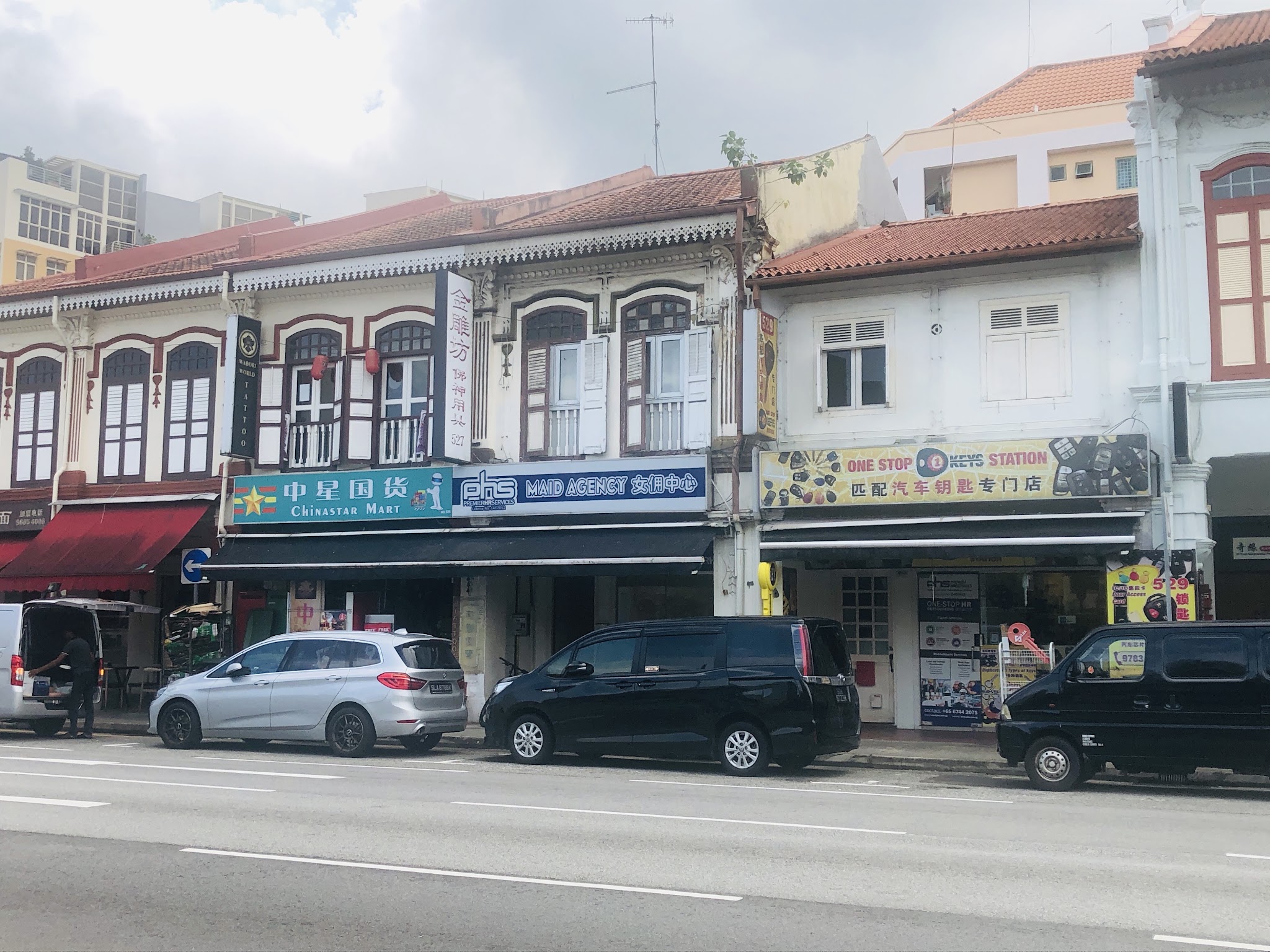 The Geylang Road shophouse row, with the yellow One Stop Keys Station signboard at number 529
